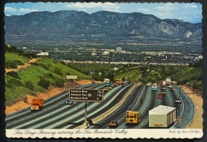 View of the 405 (San Diego Freeway) from the Sepulveda Pass ("near the top of Mulholland Blvd."), with the Valley spread out below. After 1964.